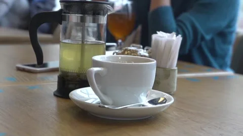 Hand taking cup of tea in a cafe, restaurant, slow motion Video stock 61805980