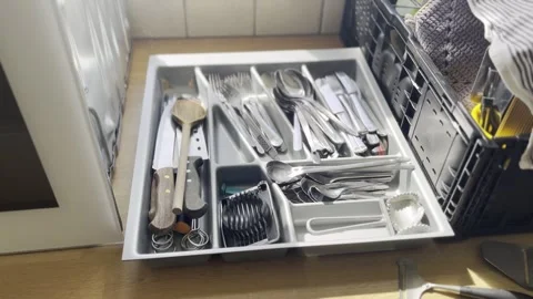 Hand Taking Cutlery from Messy Kitchen Utensil Organizer Stock Footage 340109421