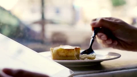 Hand taking delicious cake close to the window, slow motion Stock Footage 143280814