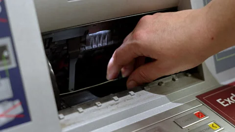 Hand Taking Dollar Bills From ATM Dispenser Video stock 324528719