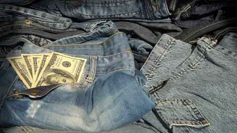 Hand taking dollars from jeans in slow motion. Stock Footage 125795995