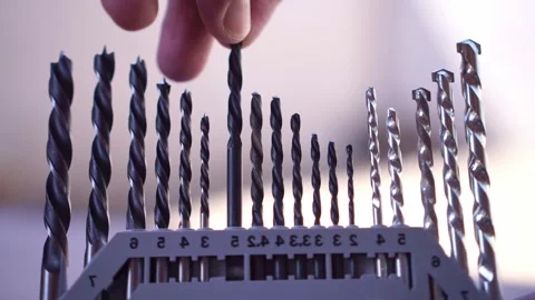 Hand taking drill bit back from the case, hardware tool organization, Stock Footage 345293573