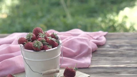 Hand taking few red strawberry from bowl. Stock Footage 90284414