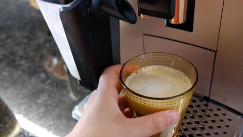 Hand Taking Freshly Brewed Coffee from Coffee Machine in Modern Kitchen Stock Footage 302687622