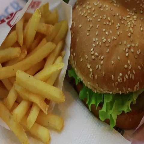 Hand taking fried potatoes Video stock 69546540