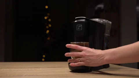 Hand taking full glass of tea from machine Stock Footage 144440897