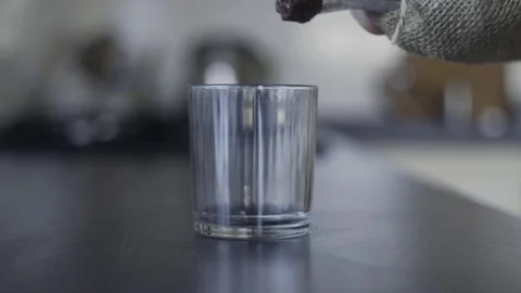 Hand Taking a Glass Man Drinking Cool Water. Not Completely Drunk Cup of Water 스톡 동영상 71892787