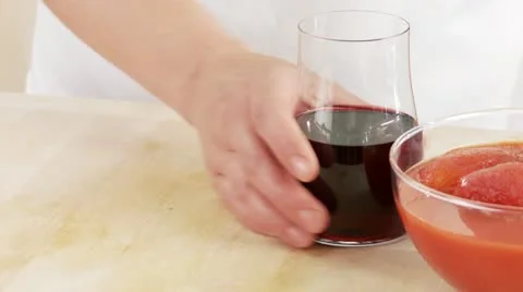 A hand taking a glass of red wine Stock Footage 24636441