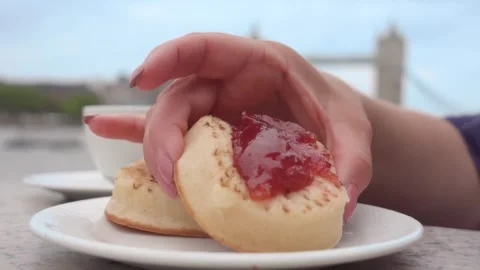 Hand Taking Jam Pancake from Saucer Stock Footage 333312710