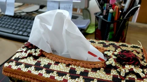 Hand taking multiple tissues from a tissue box, Disinfection from virus bacteria Stock Footage 232443302