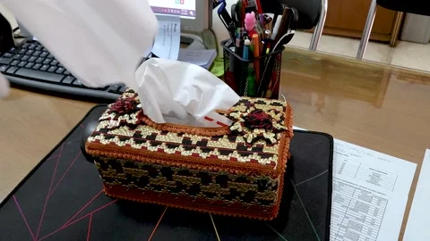 Hand taking multiple tissues from a tissue box, Disinfection from virus bacteria Stock Footage 232443352