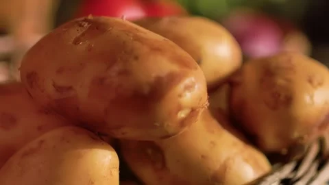 Hand taking new potatoes from a wicker basket Stock Footage 312469053