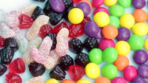 Hand taking one candy from stack of gummy bears,jelly candies 库存影片 202600832