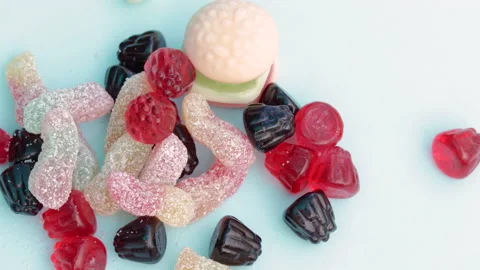 Hand taking one candy from stack of gummy bears,jelly candies Video stock 202601049