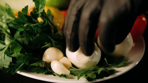 Hand taking the onion out of the vegetable plate Stock Footage 125458448
