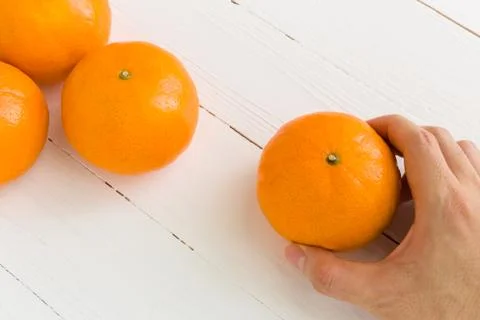 Hand Taking Orange Background / Hand Taking Orange Stock Photos