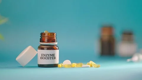 HAND TAKING OUT ENZYME BOOSTER TABLETS FROM MEDICINE BOTTLE Видео 308111437
