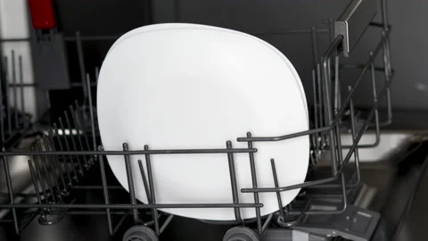 Hand taking off out plates from automatic dishwasher machine,detergent pod Видео 213512286