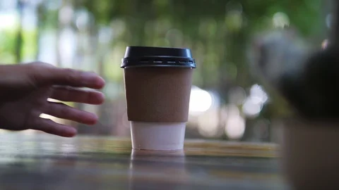 Hand taking paper cup of coffee, hot beverage for breakfast, takeaway service Stock Footage 118847135