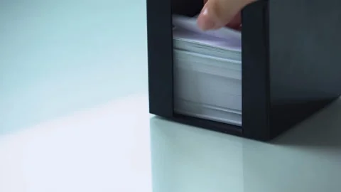 Hand taking paper from note holder, office supply organizing for work stationery Stock Footage 98819843