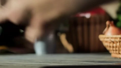 Hand taking a pepper mill from a table with colorful vegetables Stock Footage 311890815