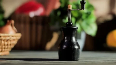 Hand taking a pepper mill from a table with colorful vegetables Stock Footage 328344900