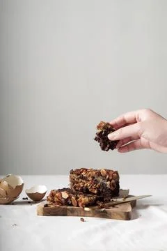 Hand taking a piece of cake Stock Photos