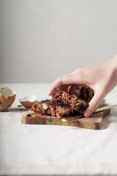 Hand taking a piece of cake Stock Photos