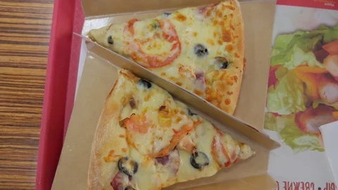 Hand taking piece of pizza, close-up Stock Footage 81564420