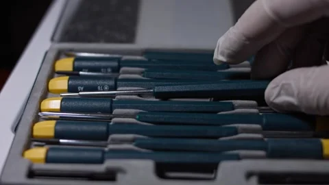 Hand taking a screwdriver from the set, close up Stock Footage 324368205