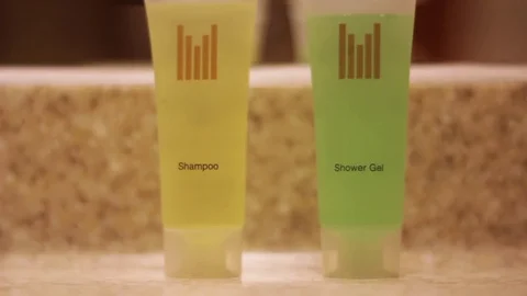 Hand taking shower gel  in hotel bathroom Stock Footage 83267727