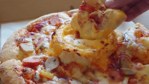 Hand Taking a Slice of Hot Cheesy Sausage Pizza from Delivery Box. 動画素材 344092126
