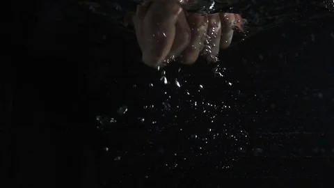 Hand taking something from water Video stock 71601530