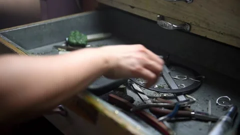 Hand taking tools from drawer at goldsmi... | Stock Video | Pond5