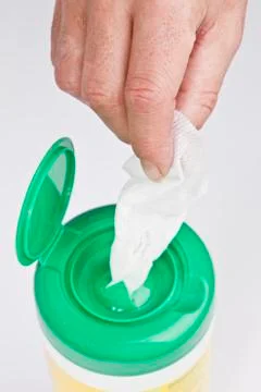 HAND TAKING A  WET WIPE Stockfoto's