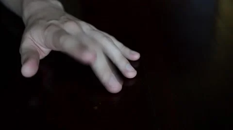 Hand Tapping on Black Table Stock Footage 50746450