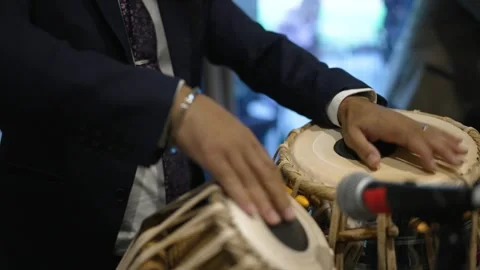 Hand tapping a Bongo drum in close up. Stock Footage 277353219