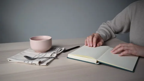 Hand tapping fingers on notebook at desk Video stock 328003666
