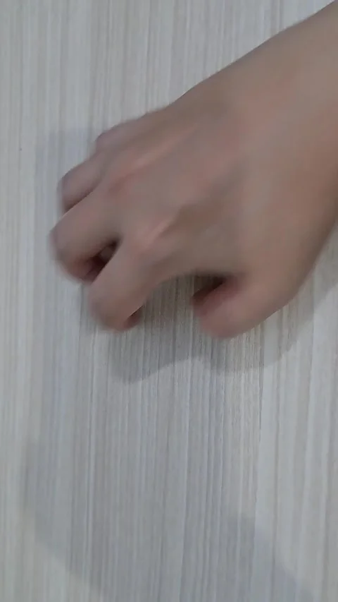 Hand Tapping on Light Wood Surface Vertical POV Stock Footage 331415271