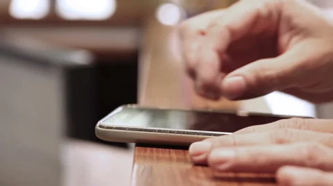 Hand tapping smartphone with touch screen Stock Footage 68804793