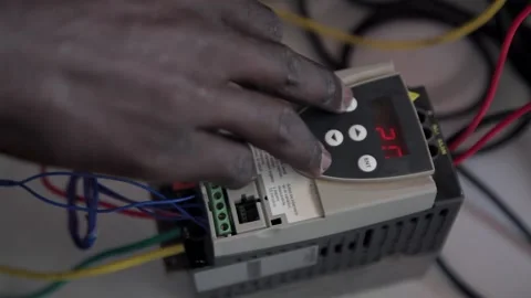 Hand of a technician manipulating an electronic device Stock Footage 200916929