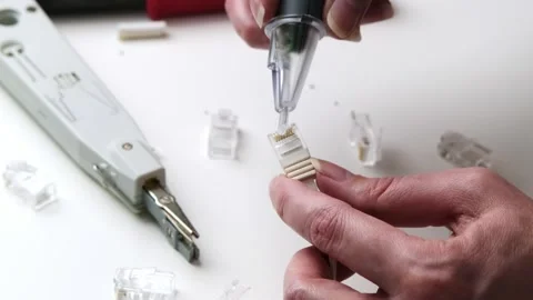 Hand Testing and Assembling Ethernet Connector with Network Cable in a Clea.. Stock Footage 309550174