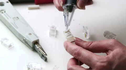 Hand testing and assembling ethernet connector Stock Footage 310198222