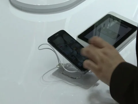 Hand testing smartphone with zoom in Stock Footage 73896518