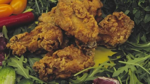 Hand in thought chooses between junk food and healthy food decides to take both Stock Footage 125653689