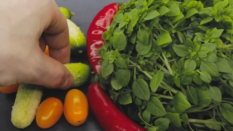 Hand in thought chooses between junk food and healthy food decides to take both Stock Footage 125653747