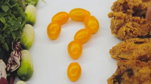 Hand in thought chooses between junk food and healthy food decides to take both Stock Footage 125653761