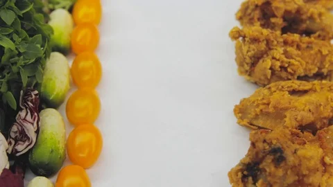 Hand in thought chooses between junk food and healthy food decides to take both Stock Footage 125653791