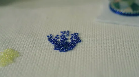 Hand is threading glass beads Stock Footage 67986530