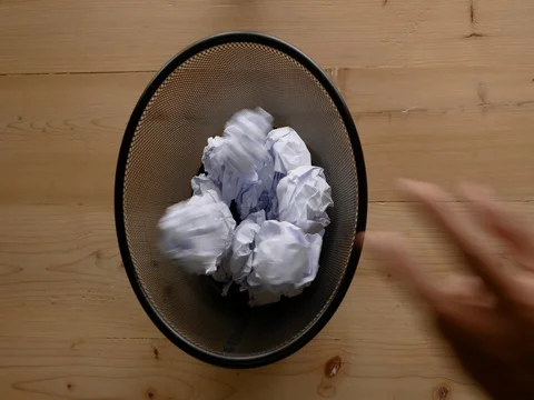 Hand throw crumpled into the trash. Stock-Footage 77411096